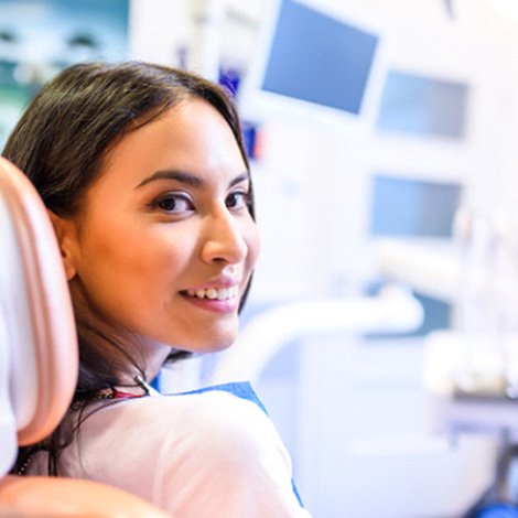 Woman sitting in dental chair waiting for gum disease treatment in Fort Mill, SC