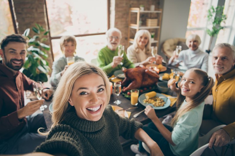 family smiling at Thanksgiving