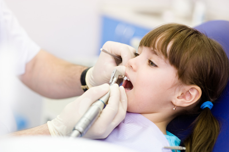 Small patient getting dental fillings